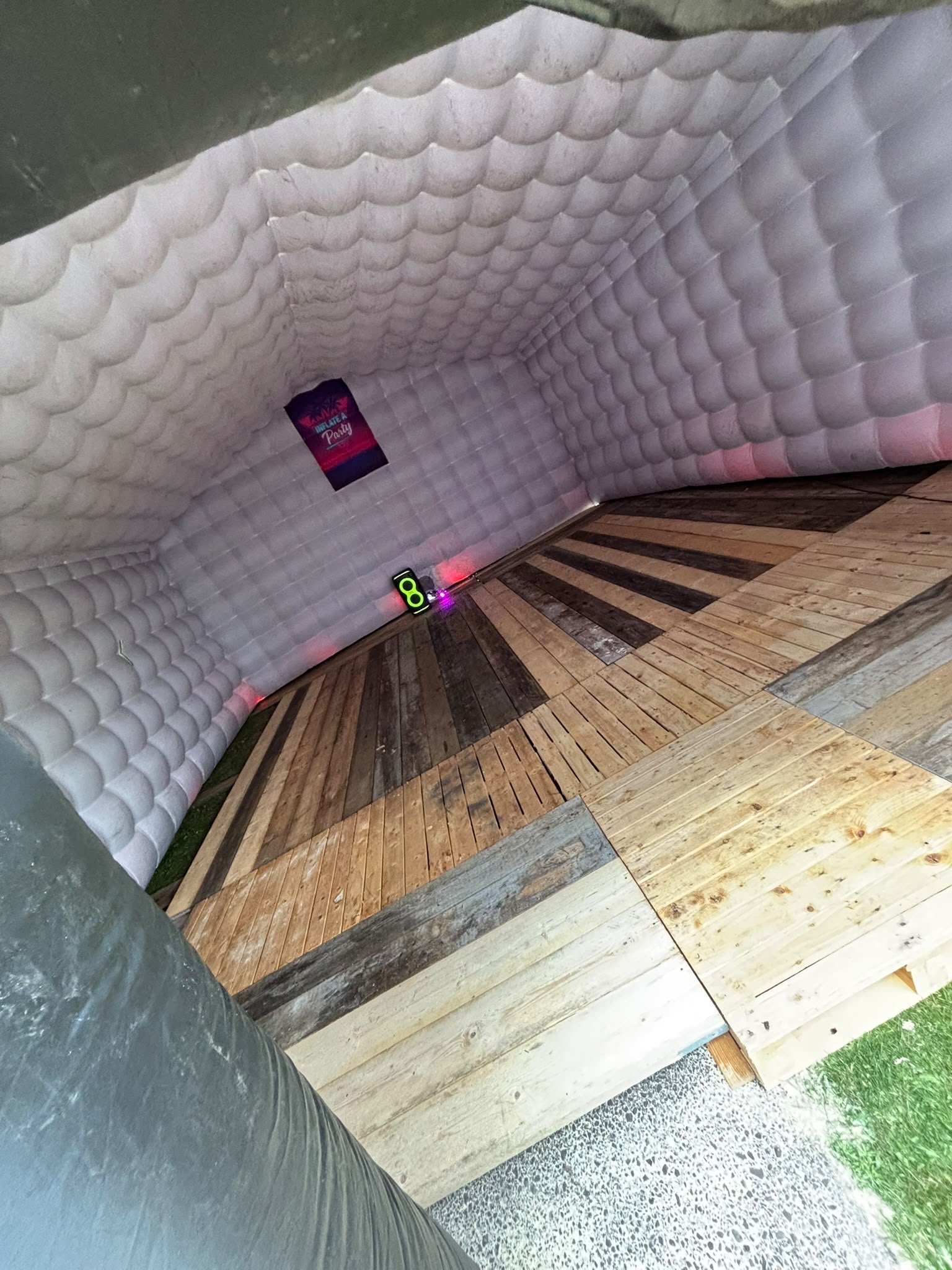 Inside the inflatable nightclub with LED lights and wooden dance floor
